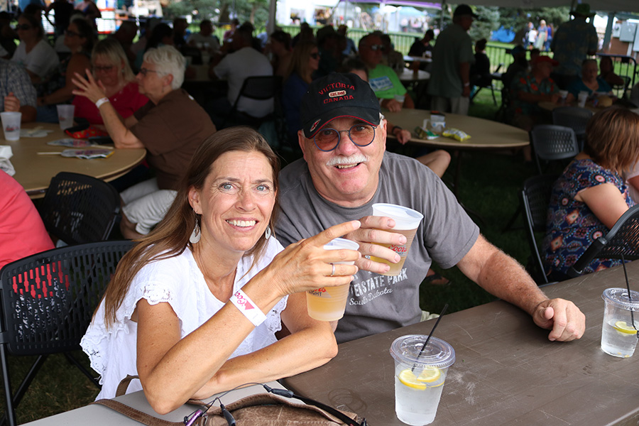 Photo of Greeley Arts Picnic patrons enjoying a beer in the beer garden
