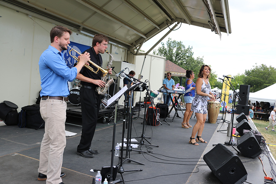 Photo of Greeley Arts Picnic band entertaining from stage