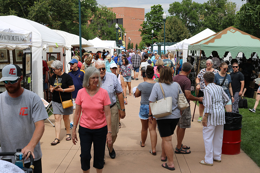 Photo of Greeley Arts Picnic patrons strolling through the vendors