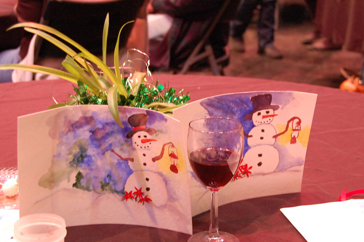 Photo of paintings and wine glass at Water Color and Wine event at Festival of Trees