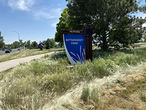 Bittersweet park sign with native grasses