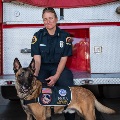 Photo of a firefighter and station dog