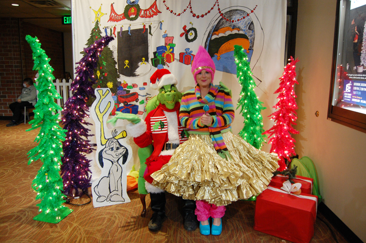 Photo of colorful Whoville resident and the Grinch at Greeley's Festival of Trees