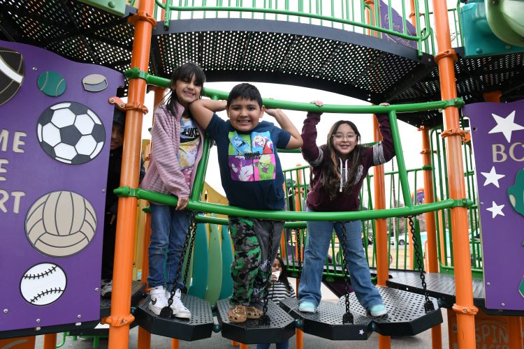 Kids playing on a playground at the Rodarte Community Center