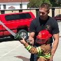 Firehose training with a young firefighter