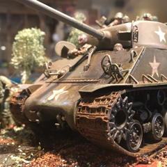 A detailed model of a World War II tank and soldiers created by Scott Chartier.