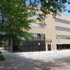 The exterior of a brown brick building with a sign that reads City Center North, City of Greeley.