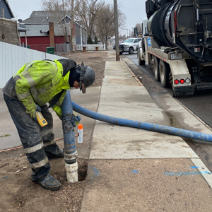 City of Greeley worker conducting potholing work